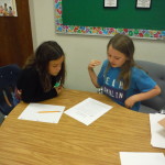 Students read with a partner to adapt and solve a riddle tale.