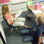Students read with a partner to adapt and solve a riddle tale.