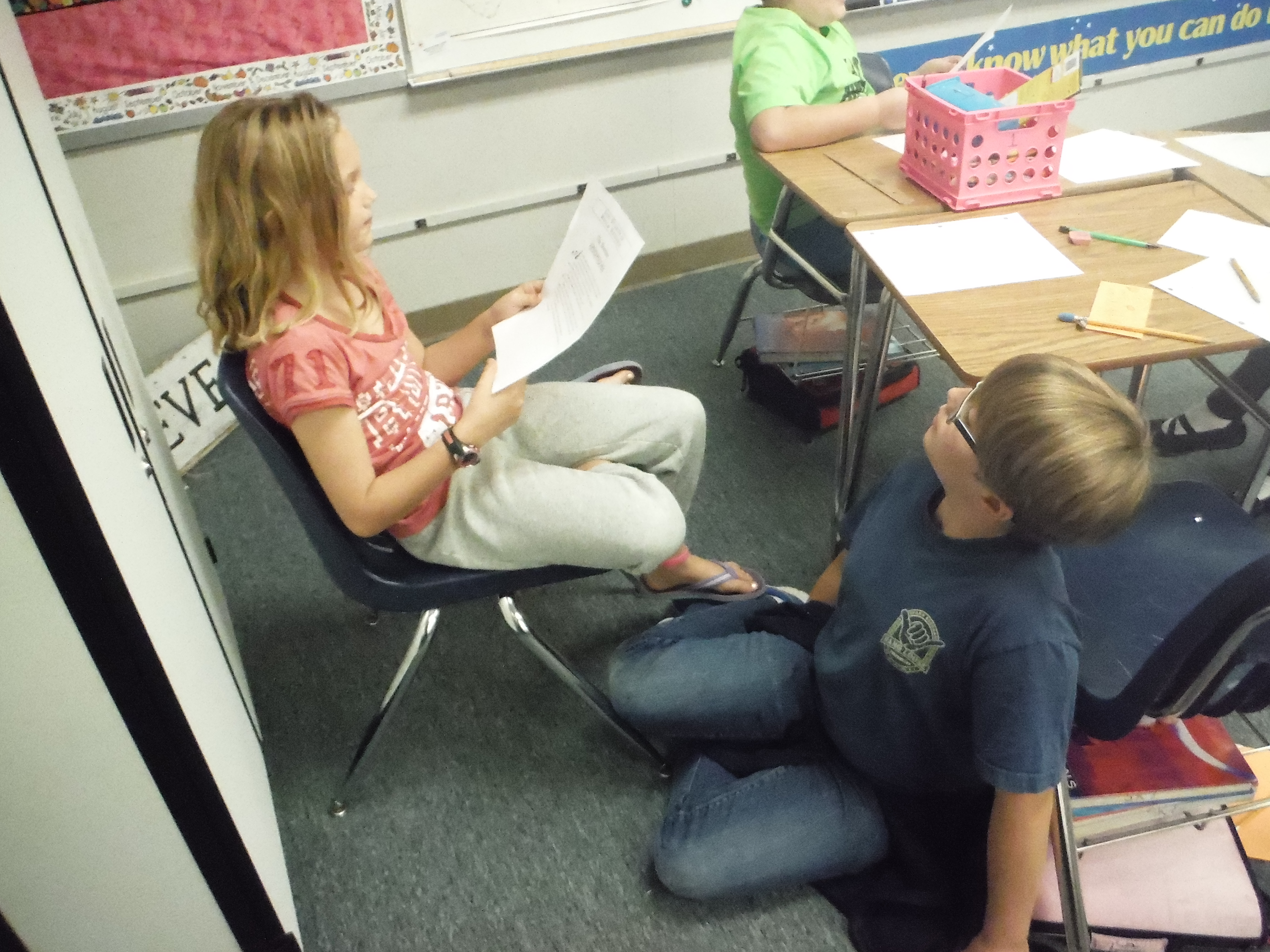 Students read with a partner to adapt and solve a riddle tale.