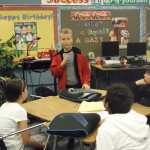 Students work in groups of 4 to retell a story.